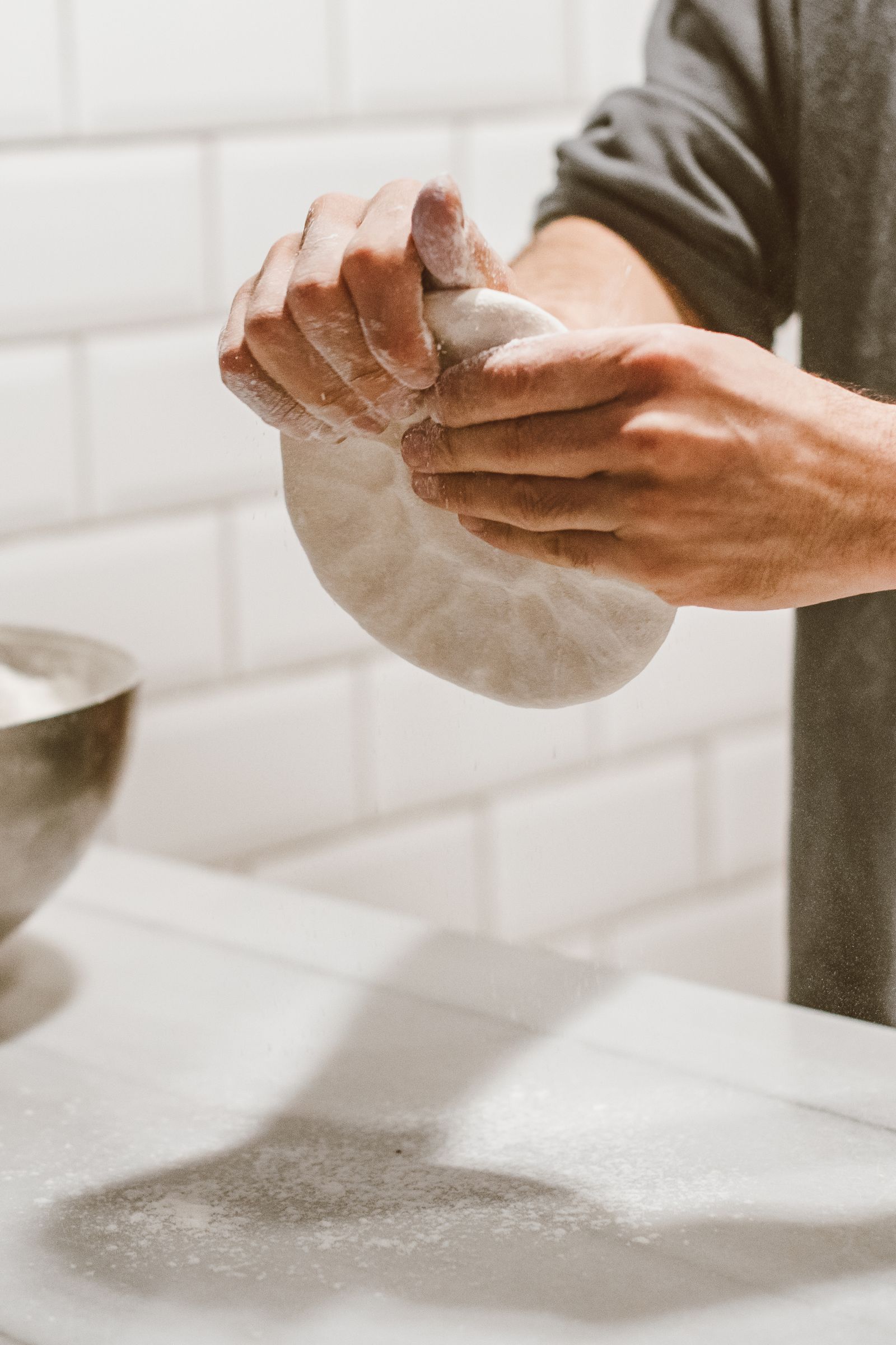 Hands at work baking in a home kitchen